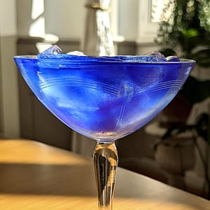 blue martini made with Corsican gin, cucumber, and butterfly pea tea