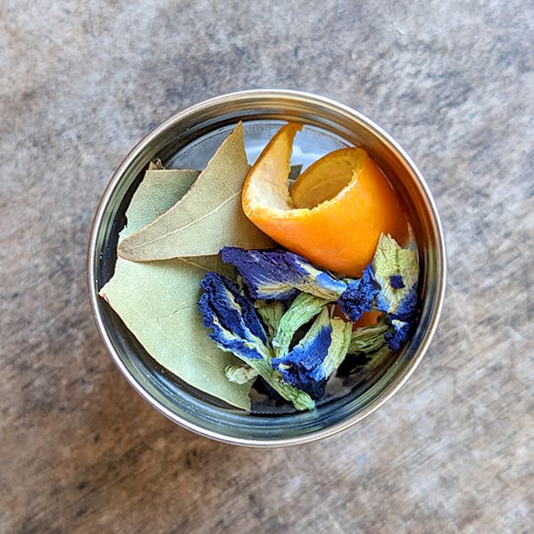 Butterfly pea infusion cinnamon leaves and mandarin